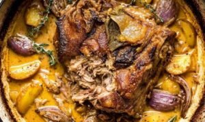 Apple Cider Braised Beef Apple Cider Braised Beef in a dutch oven with apples, red onions, and fresh herbs