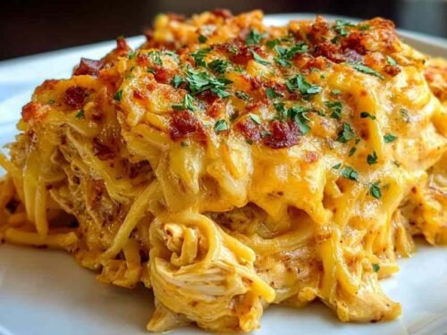 Garlic Butter Chicken Bites and Potatoes in a cast iron skillet with golden seared chicken bites, crispy baby potatoes, and fresh parsley