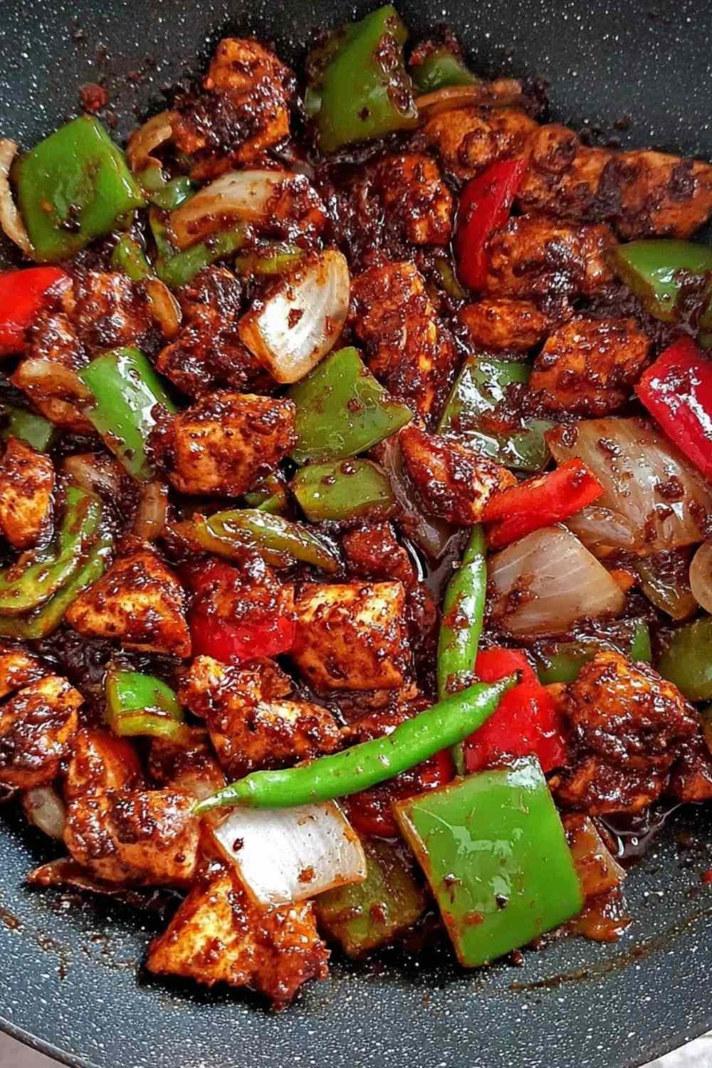 Easy black pepper chicken recipe served over steamed jasmine rice in a white bowl