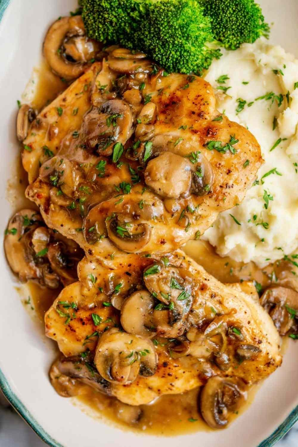 Easy chicken Marsala in a skillet with creamy Marsala wine sauce, sliced mushrooms, and golden seared chicken breasts