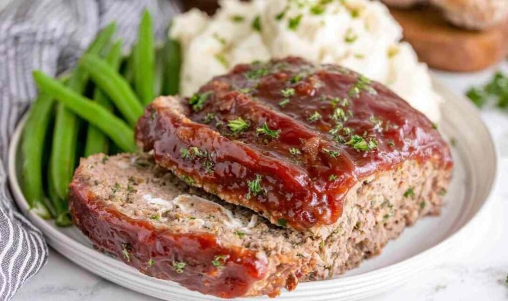 Homemade meatloaf recipe with caramelized ketchup glaze fresh out of the oven in a 9x5 loaf pan