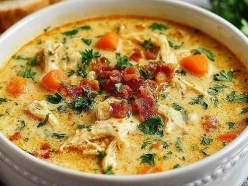 Crack chicken soup in a large stockpot with shredded chicken, pasta, crispy bacon, and melted cheddar cheese