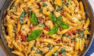 One Pot Tuscan Chicken Pasta One pot tuscan chicken pasta with sun-dried tomatoes, spinach, and creamy Parmesan sauce in a large deep skillet