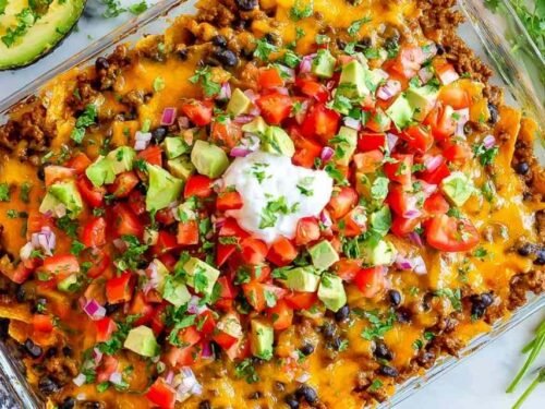 Easy taco casserole baked with melty cheese and served with sour cream, cilantro, and avocado