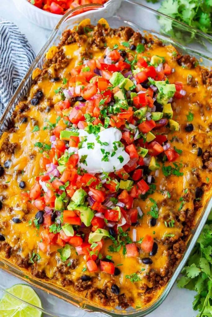 Easy taco casserole baked with melty cheese and served with sour cream, cilantro, and avocado