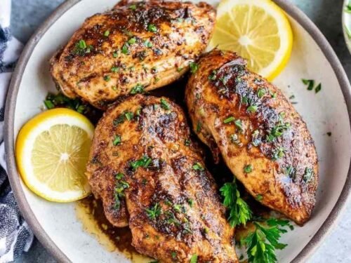 Raw chicken breasts soaking in homemade chicken marinade inside a zip-top bag