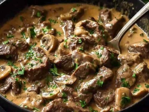 Gordon Ramsay's Beef Stroganoff served over buttered egg noodles, garnished with fresh chives