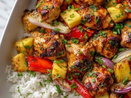 Hawaiian Chicken Sheet Pan with juicy chicken breast, caramelized pineapple chunks, and colorful bell peppers on a parchment-lined baking sheet