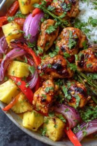 Hawaiian Chicken Sheet Pan with juicy chicken breast, caramelized pineapple chunks, and colorful bell peppers on a parchment-lined baking sheet