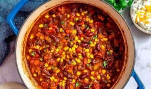 The Best Vegetarian Chili Bowl of homemade vegetarian chili topped with avocado slices and sour cream