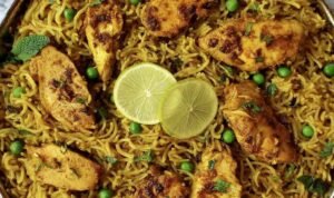 One pan Mediterranean chicken and rice with golden seared chicken, turmeric-spiced rice, and fresh herbs in a dark skillet